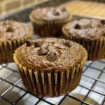 Close-up of protein muffins with a golden-brown exterior.